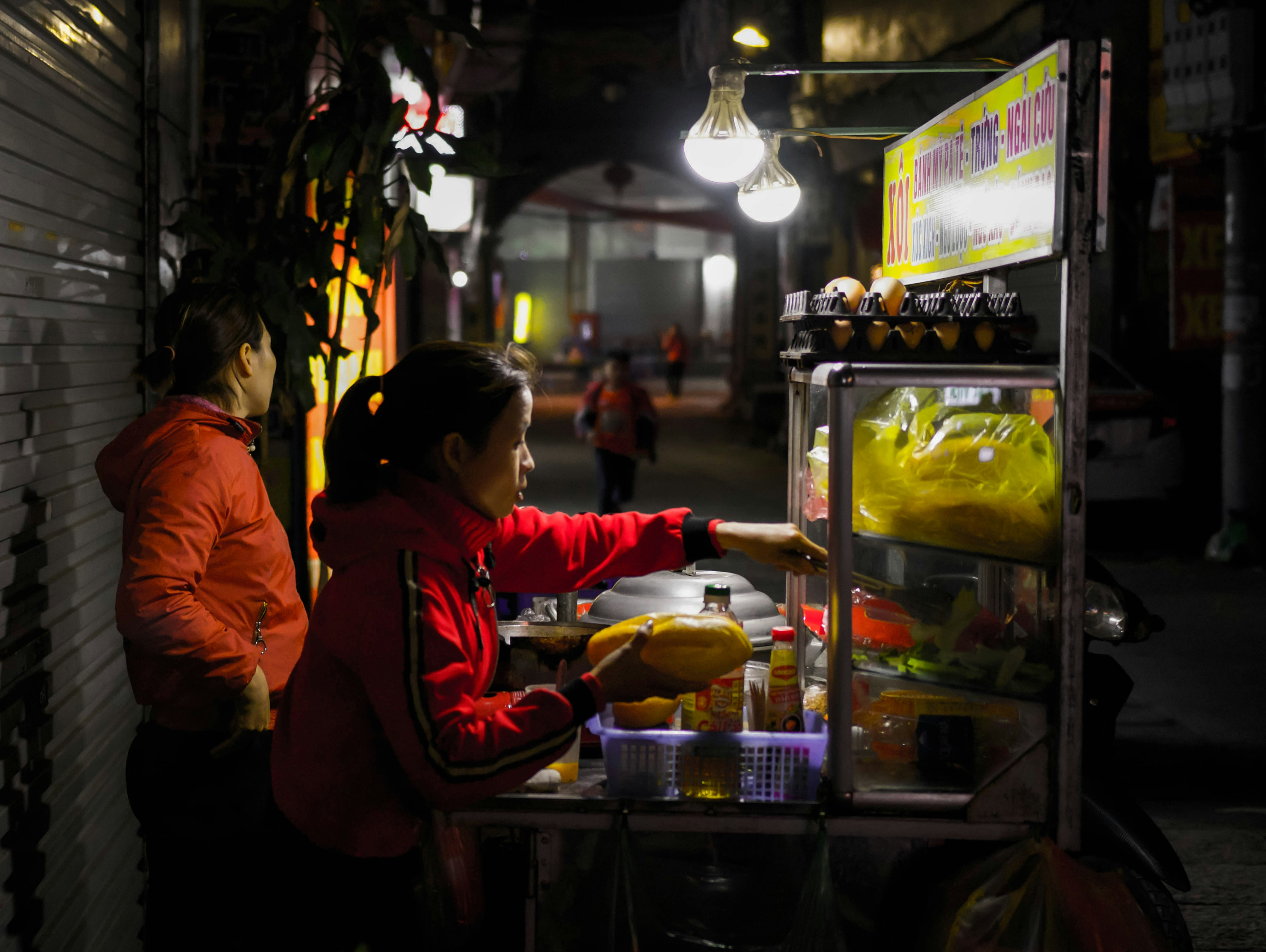 Woman gazing through two glasses of water